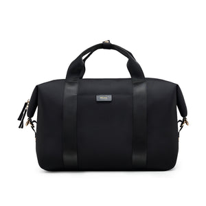 OIWAS City Wanderer black travel bag worn crossbody in city street