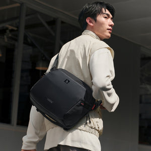 Worn by traveler: Large ELEPHANTOM messenger bag as a standalone carry for day trips.