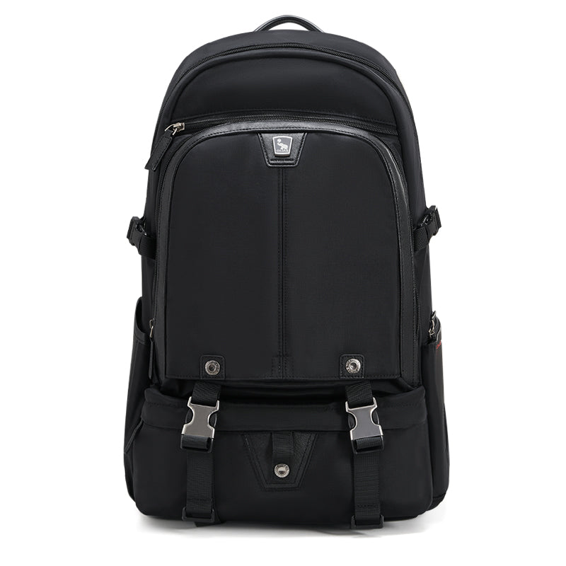 OIWAS TRIUMPH waterproof travel backpack in urban setting, featuring sleek black design, front organizer pockets, and trolley pass-through strap.