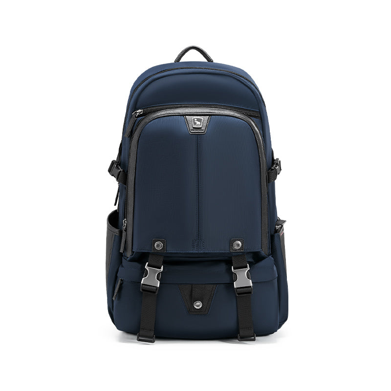 OIWAS TRIUMPH waterproof travel backpack in urban setting, featuring sleek blue design, front organizer pockets, and trolley pass-through strap.