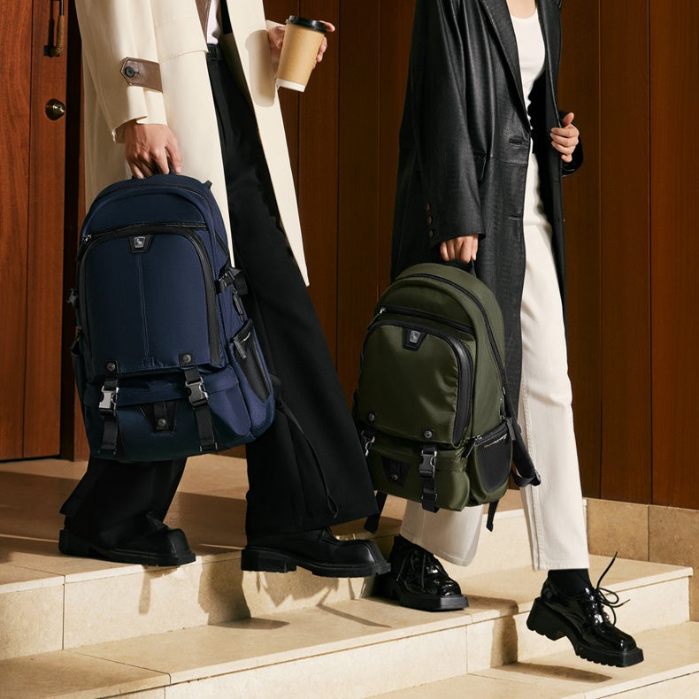 Traveler wearing OIWAS TRIUMPH anti-theft backpack while walking through airport — lightweight and carry-on compliant.