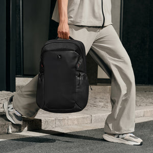 OIWAS ELEPHANTOM 16-inch laptop backpack with trolley sleeve, worn by traveler in urban setting — sleek, lightweight design for daily commute and business travel