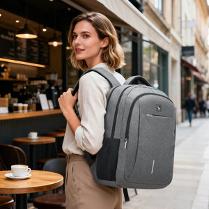 Gray OIWAS 17" business laptop backpack with USB charger, water-resistant fabric, and secure anti-theft pocket for commuters.