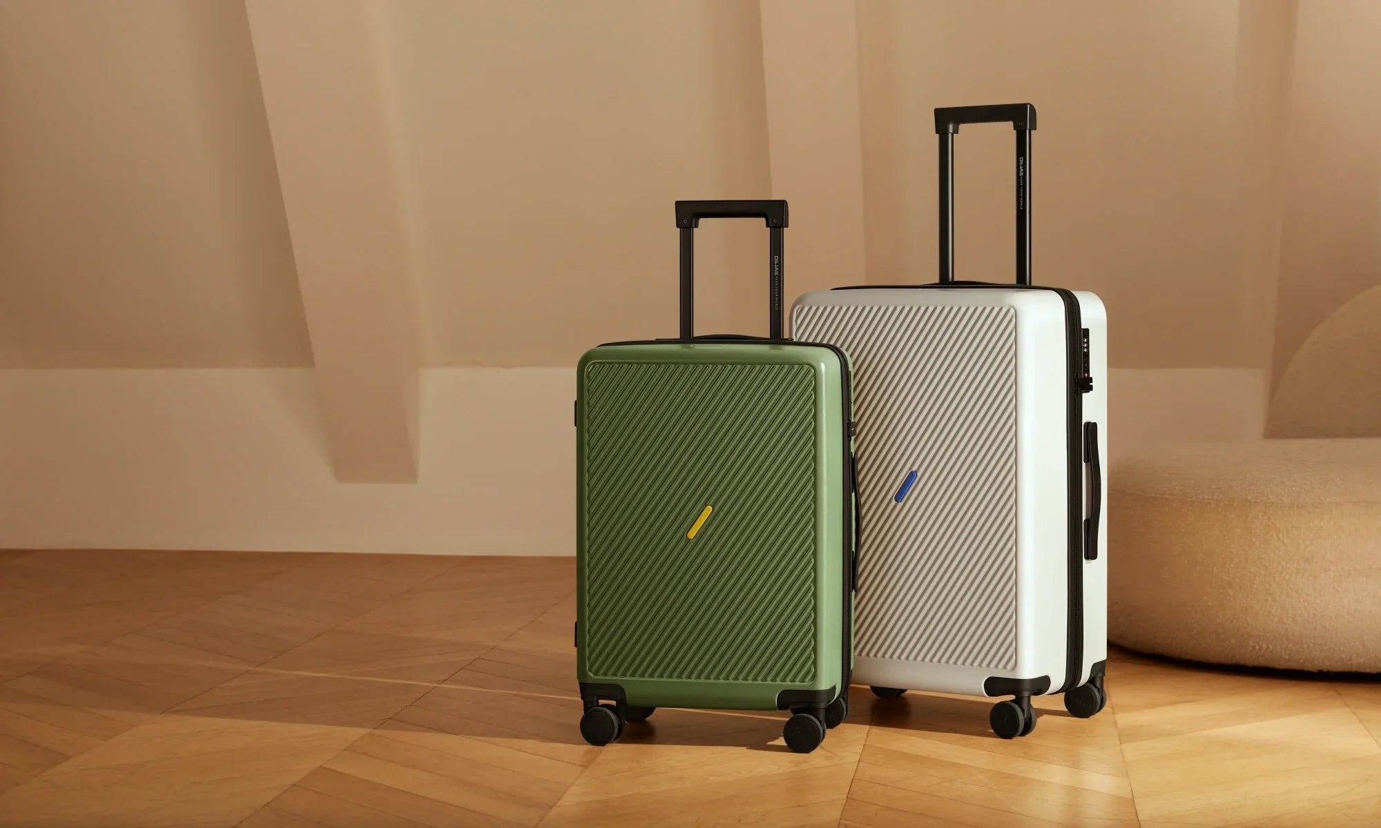 OIWAS hard-shell suitcases in green and white standing upright on wooden floor