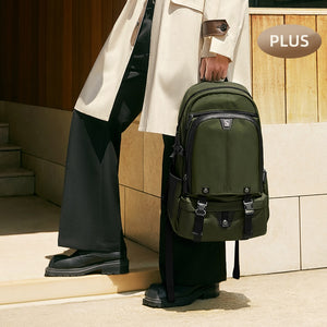 Traveler wearing OIWAS TRIUMPH anti-theft backpack while walking through airport — lightweight and carry-on compliant.