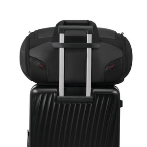 OIWAS travel bag with trolley sleeve mounted on carry-on luggage for easy airport navigation.