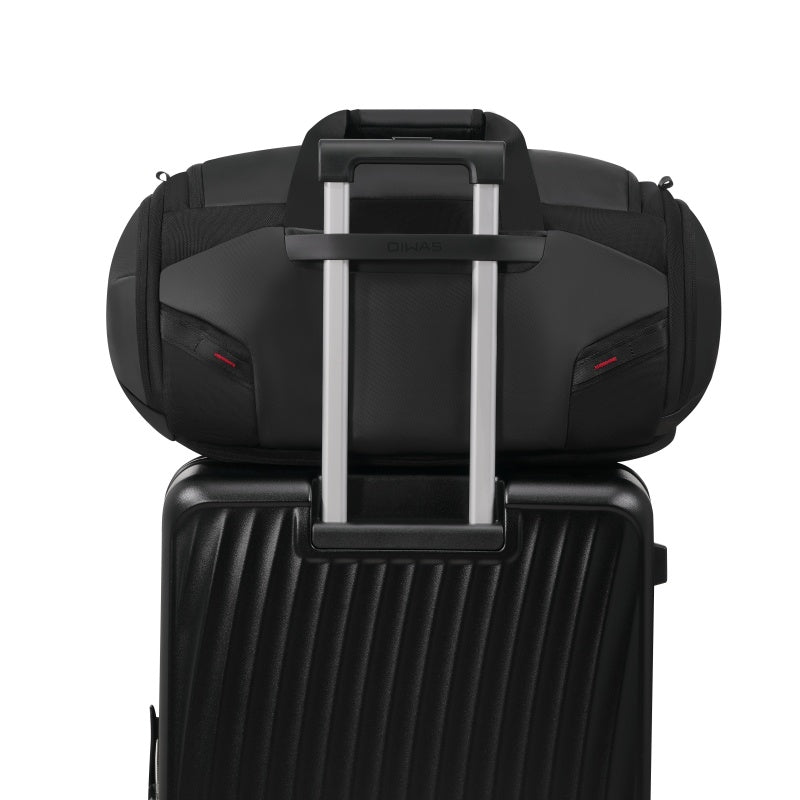 OIWAS travel bag with trolley sleeve mounted on carry-on luggage for easy airport navigation.
