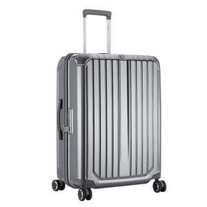 Angled shot of silver CLAD luggage under studio lighting, emphasizing reflective finish and precision craftsmanship.