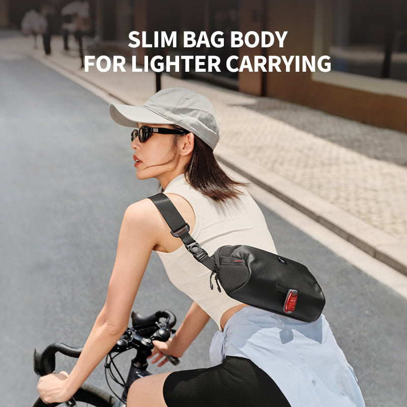 Worn view: Small ELEPHANTOM messenger bag comfortably worn crossbody by a commuter