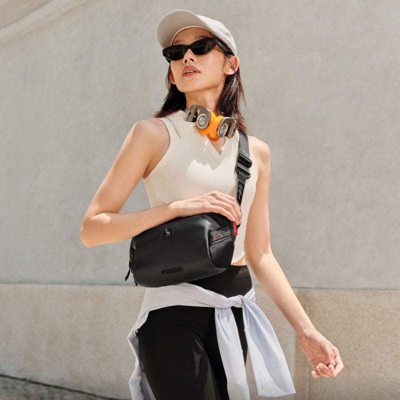 Adjustable, padded shoulder strap detail on the OIWAS Small ELEPHANTOM messenger for all-day comfort