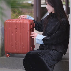 Stylish red OIWAS expandable carry-on suitcase, outfitted with a high-quality polycarbonate shell, for weekend getaway inspiration.