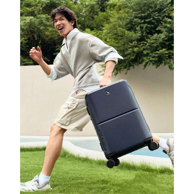 OIWAS Horizon X carry-on luggage fitting perfectly in airplane overhead bin — compliant with major airline size restrictions worldwide