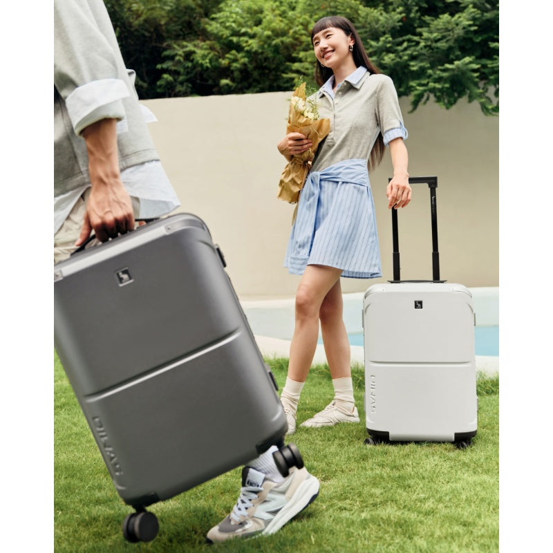 OIWAS Horizon X carry-on luggage fitting perfectly in airplane overhead bin — compliant with major airline size restrictions worldwide