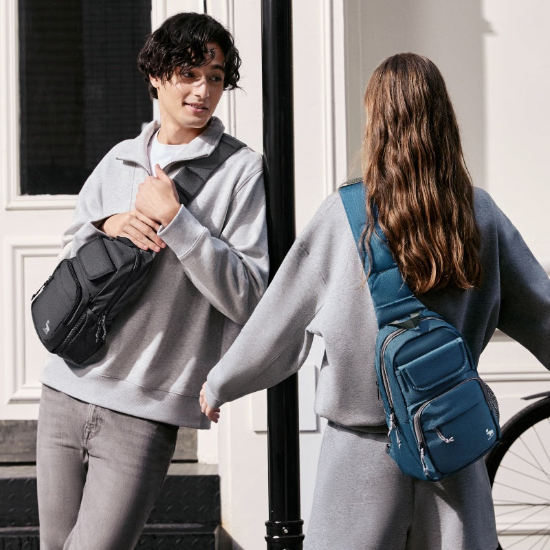 OIWAS purple sling bag worn crossbody by man & woman during urban commute